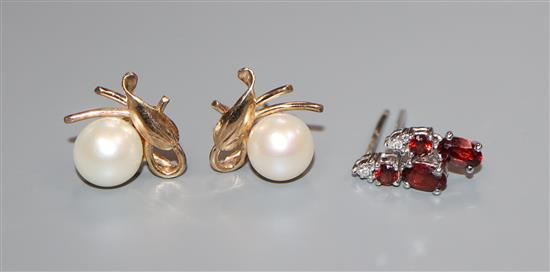 Two pairs of earrings including 14k and cultured pearl and 18ct gold and gem set.